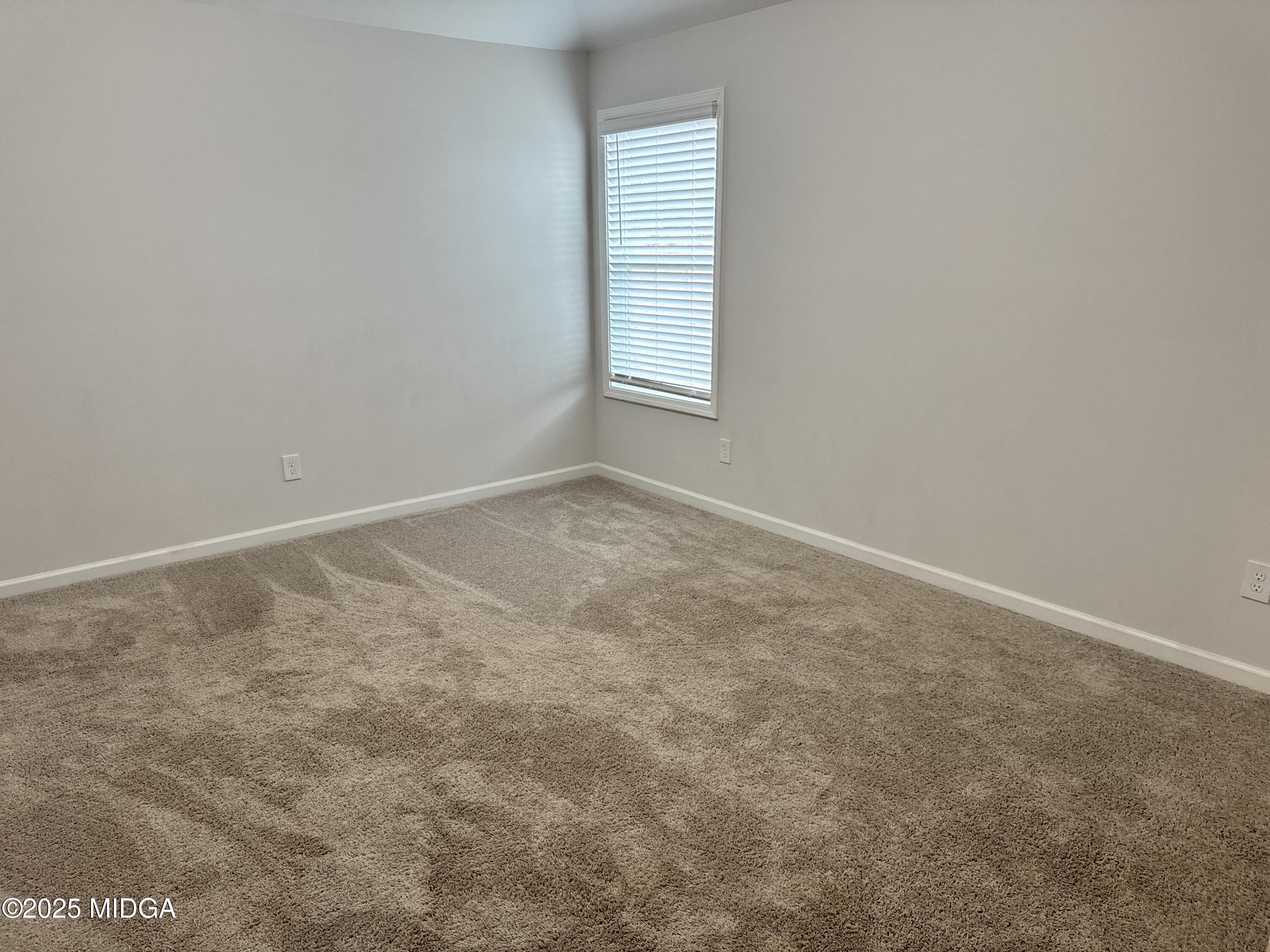 1082 Victorian Boulevard Forsyth, GA 31029 - Photo 11 of 23 an empty room with windows