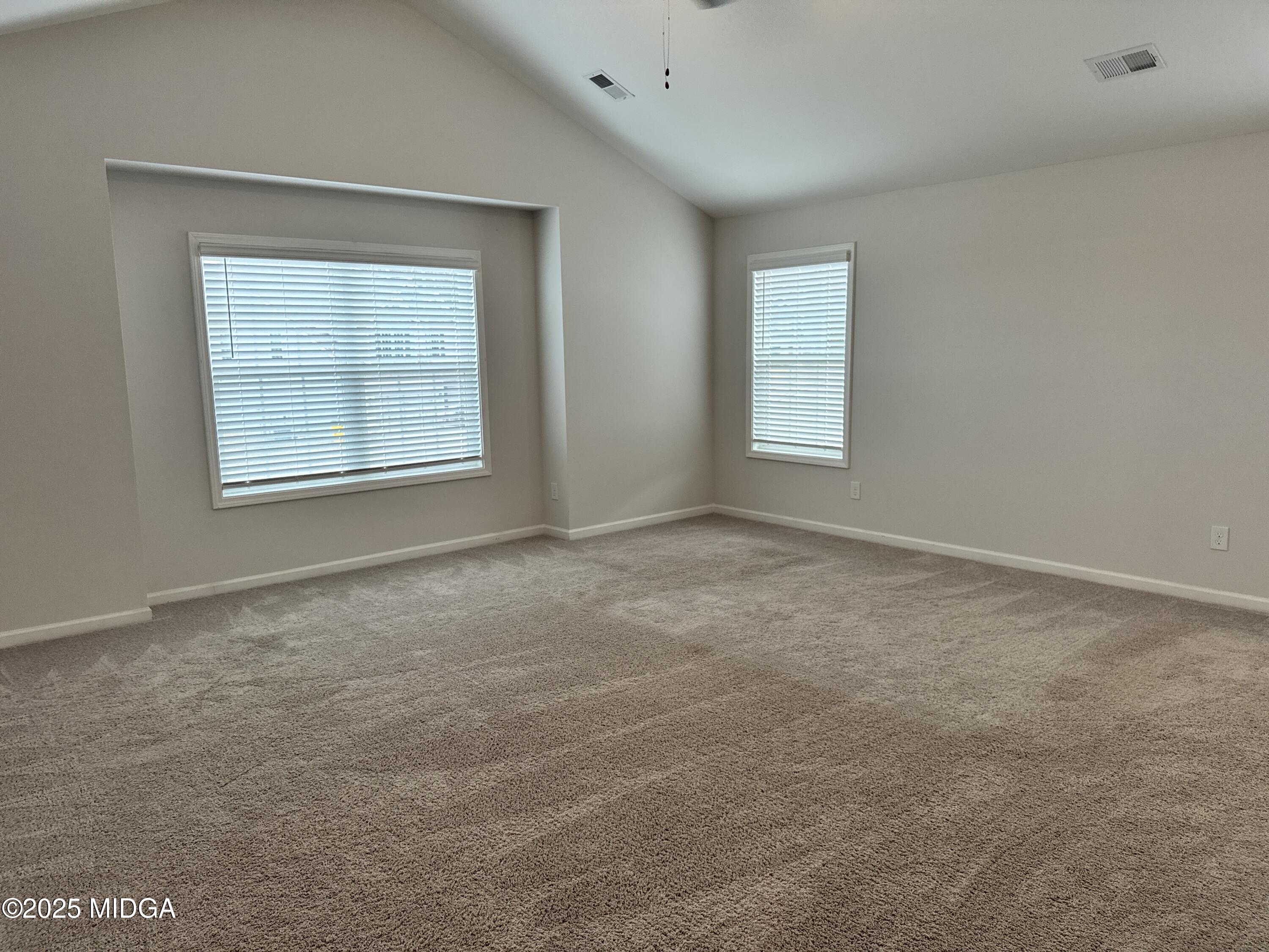 1082 Victorian Boulevard Forsyth, GA 31029 - Photo 14 of 23 an empty room with a window