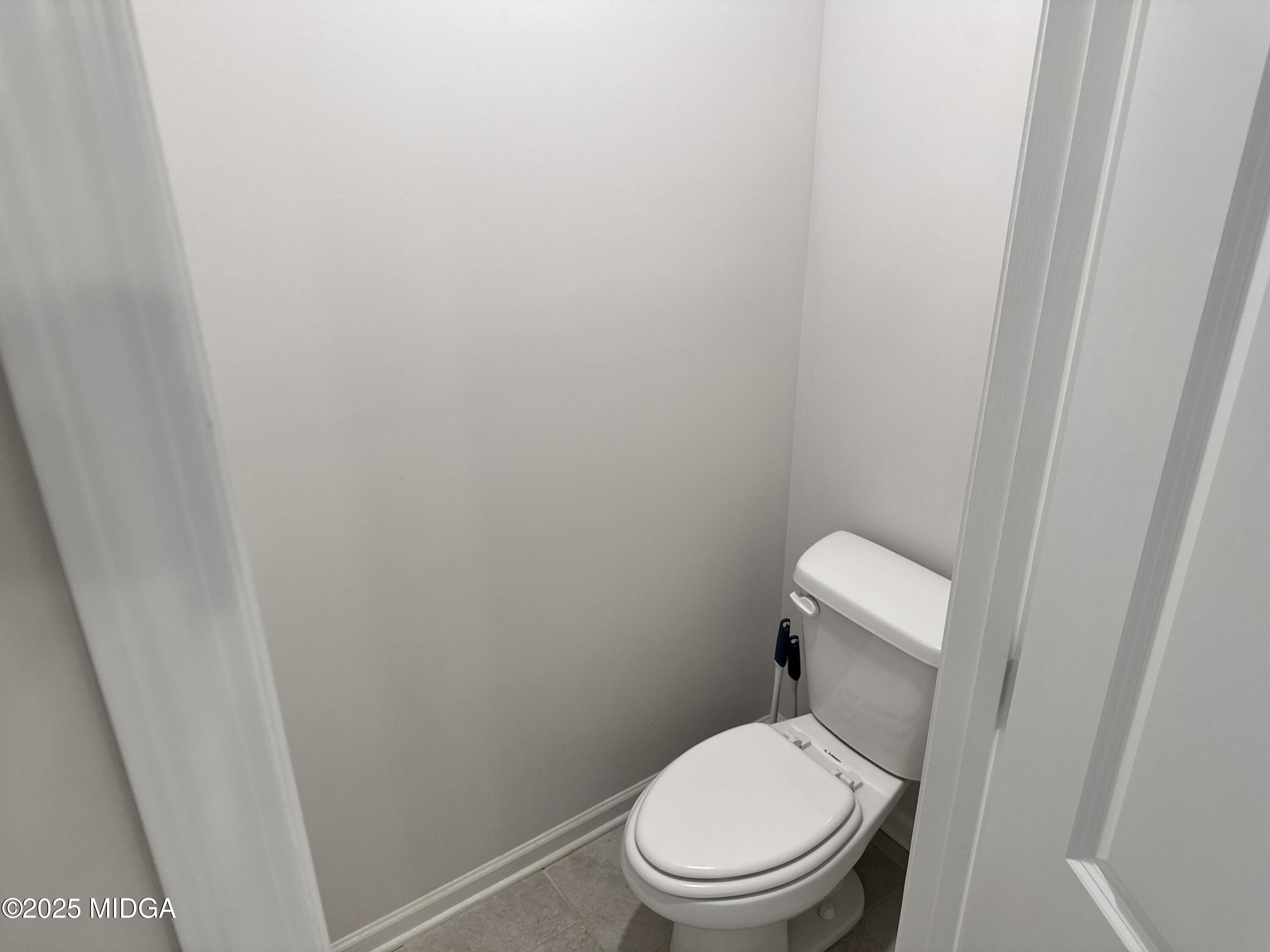 1082 Victorian Boulevard Forsyth, GA 31029 - Photo 19 of 23 a white toilet sitting next to a shower