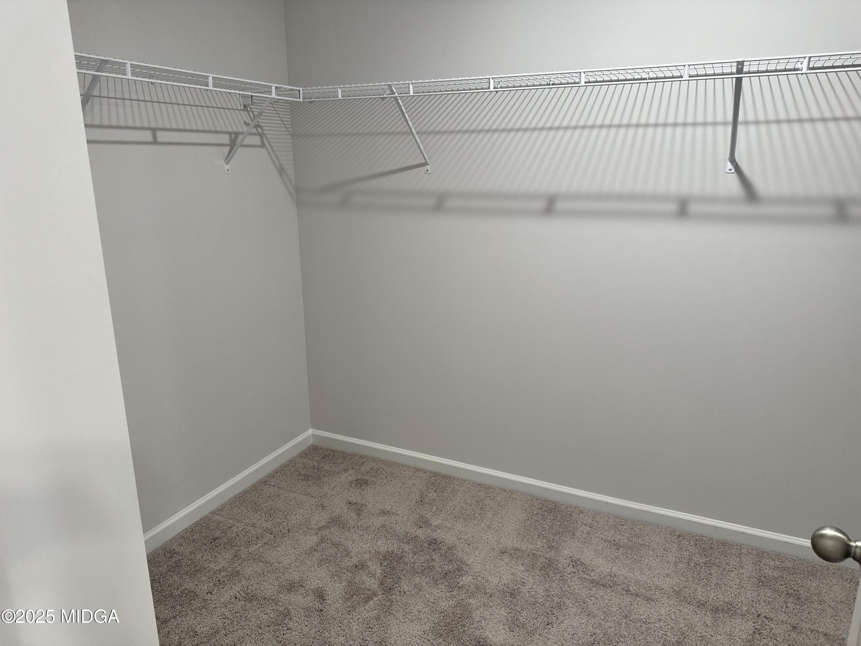 1082 Victorian Boulevard Forsyth, GA 31029 - Photo 20 of 23 a view of a room with racks on the wall