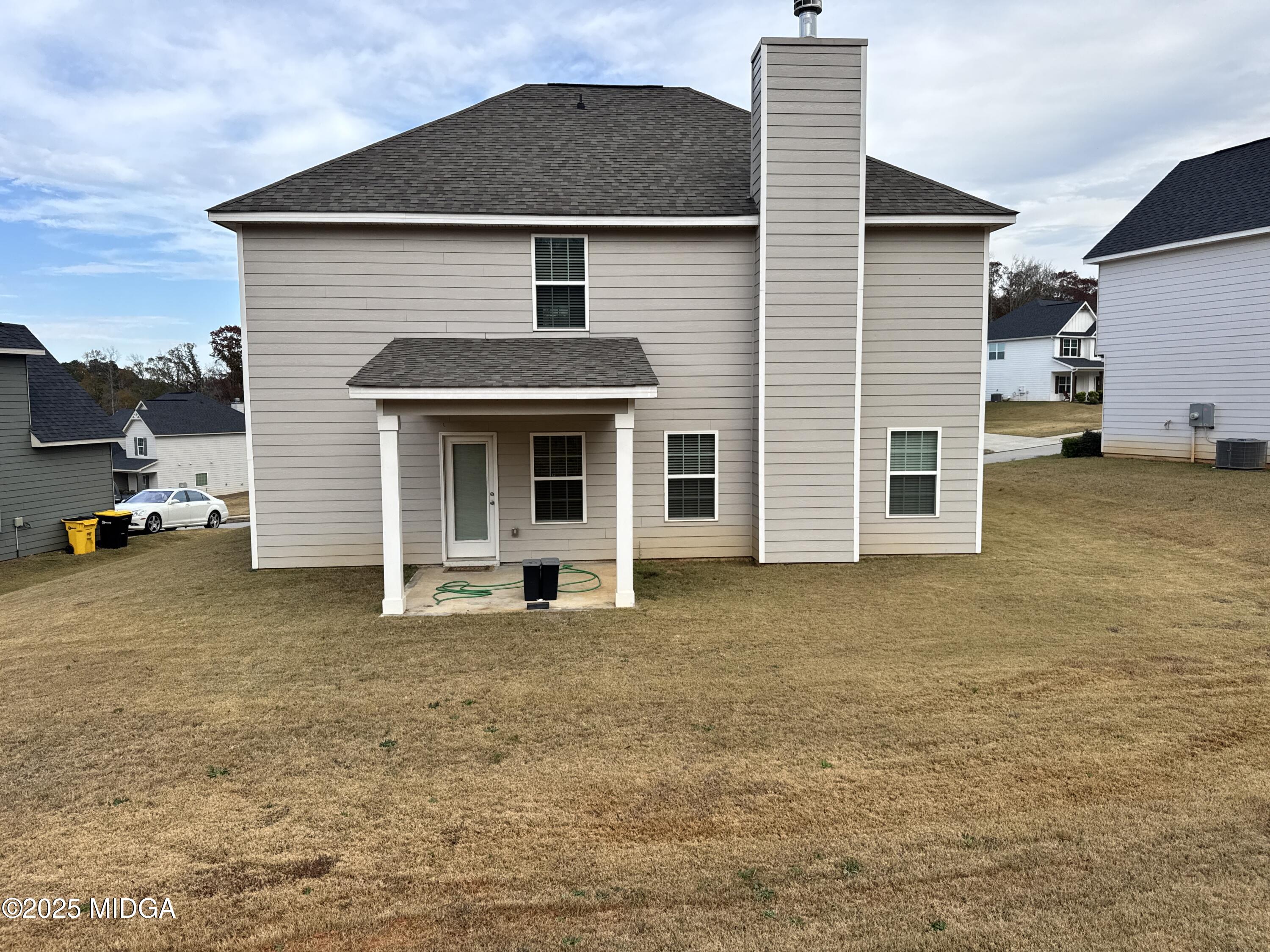 1082 Victorian Boulevard Forsyth, GA 31029 - Photo 22 of 23 a front view of a house with a yard