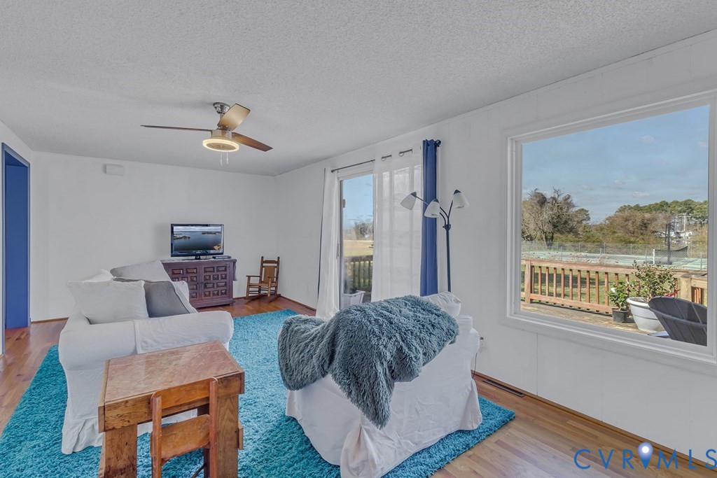 2082 Fleeton Road Reedville, VA 22539 - Photo 15 of 34 a living room with furniture and a window
