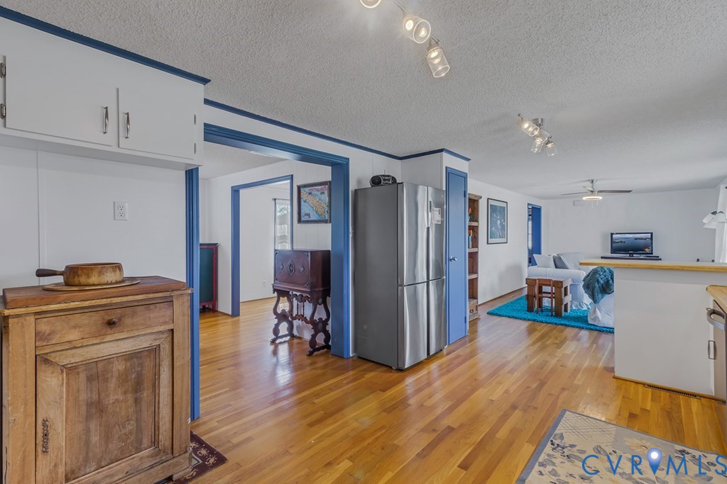 2082 Fleeton Road Reedville, VA 22539 - Photo 16 of 34 a kitchen view of a refrigerator stove and wooden floor