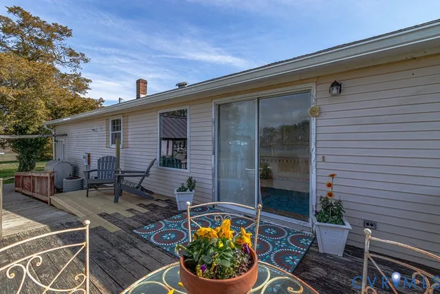 a backyard of a house with outdoor seating