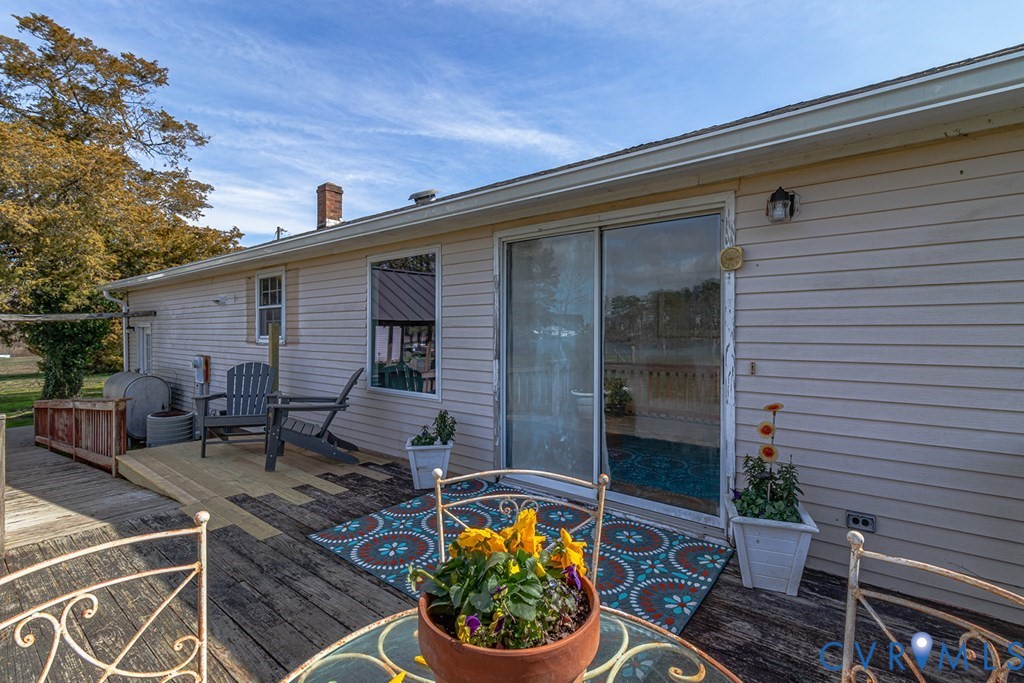 2082 Fleeton Road Reedville, VA 22539 - Photo 21 of 34 a backyard of a house with outdoor seating