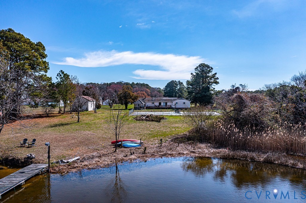 2082 Fleeton Road Reedville, VA 22539 - Photo 24 of 34 a view of a lake with a house in the background