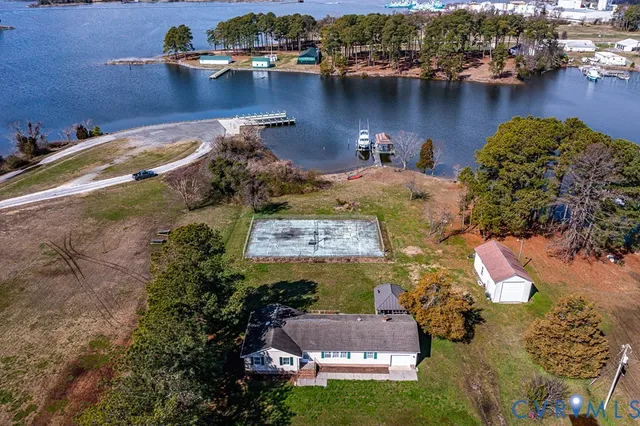 an aerial view of a house with a lake view