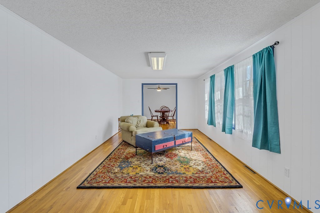 2082 Fleeton Road Reedville, VA 22539 - Photo 6 of 34 a living room with furniture rug and a rug