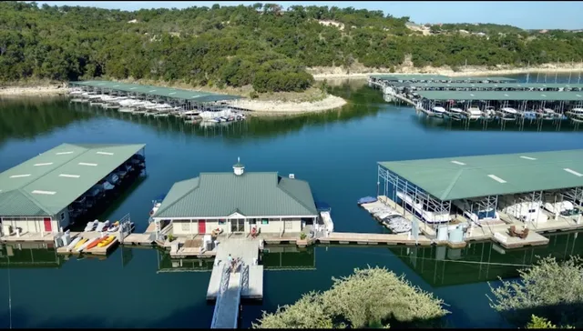 an aerial view of a house with a lake view