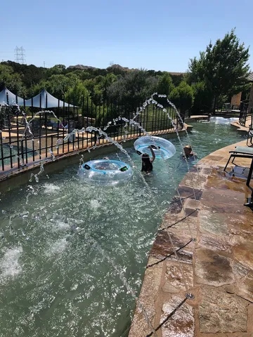 a view of a park with large trees