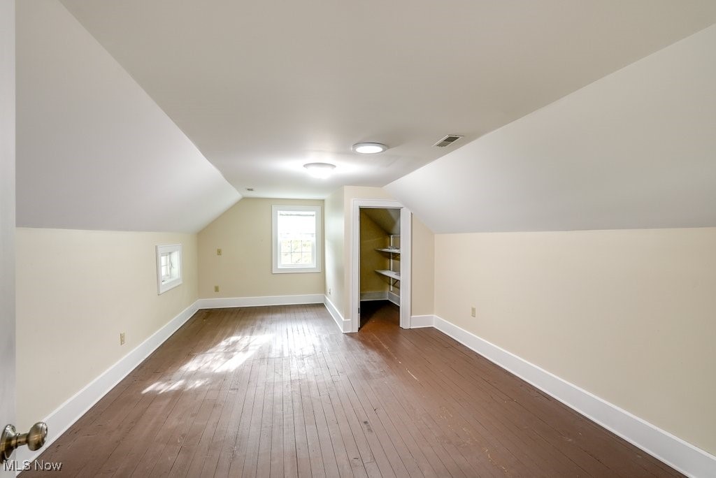 2980 Luli Road Mogadore, OH 44260 - Photo 39 of 50 Bedroom with lofted ceiling and dark hardwood / wood-style flooring