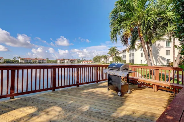 a view of a patio with a table and chairs