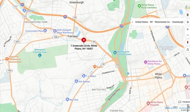 a picture of a room with a white bed and a chair