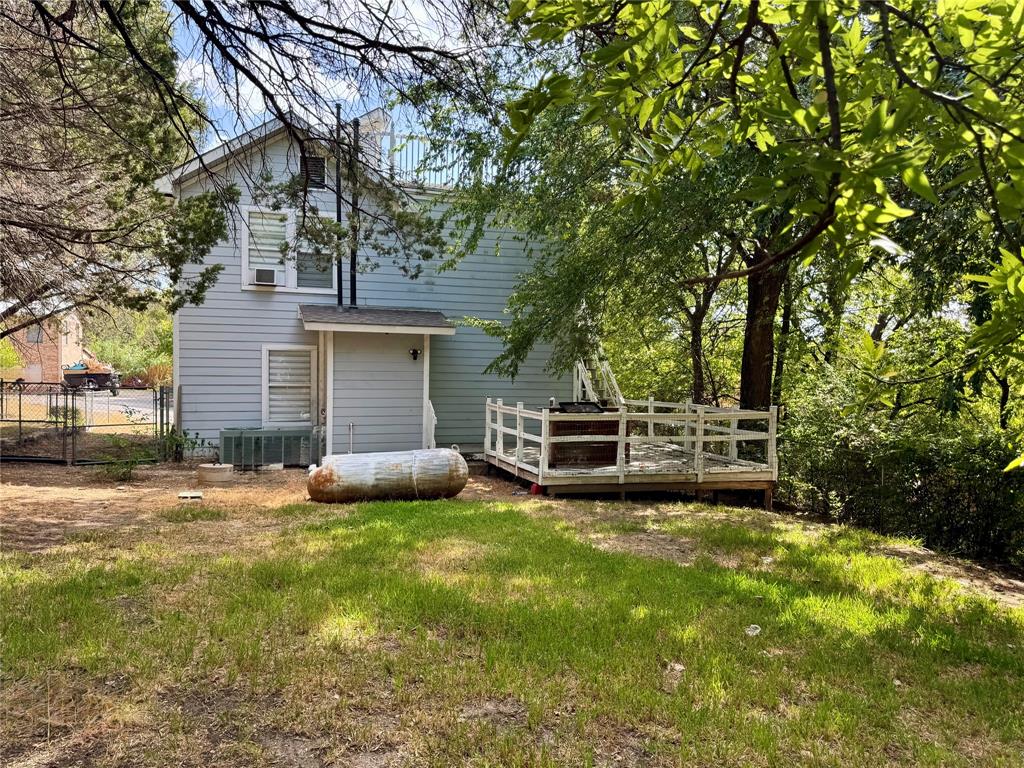 1712 Smokehouse Road Granbury, TX 76049 - Photo 2 of 25 Nice large deck, lots of shade, fenced
