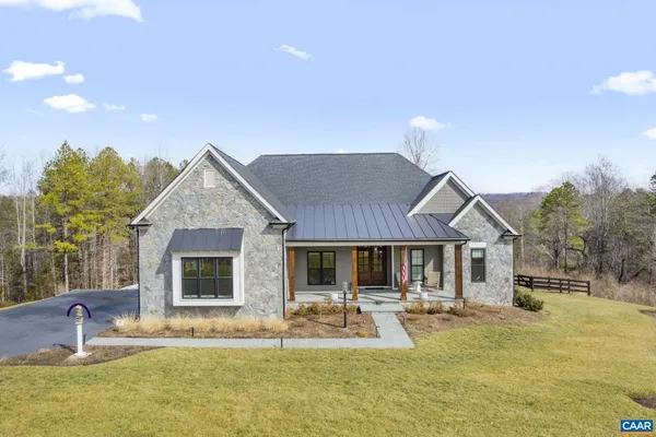 a house view with swimming pool and porch