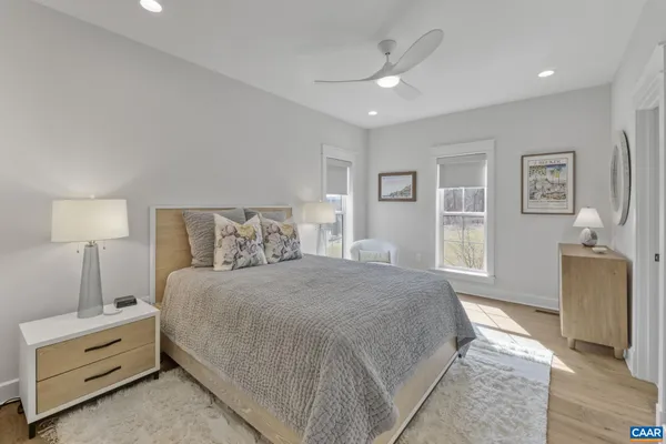 a bedroom with a bed and a couch