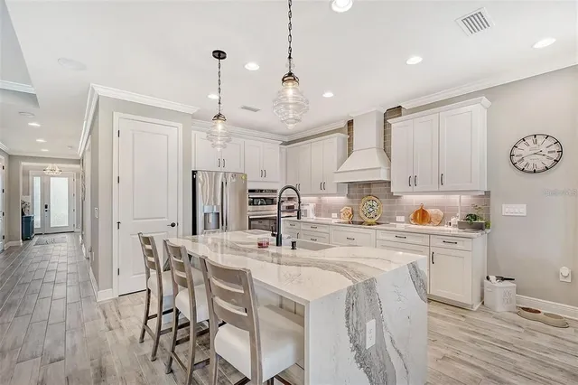 a bathroom with double vanity sink and a mirror