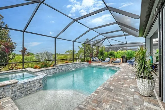 a bedroom with a bed and a dresser in it