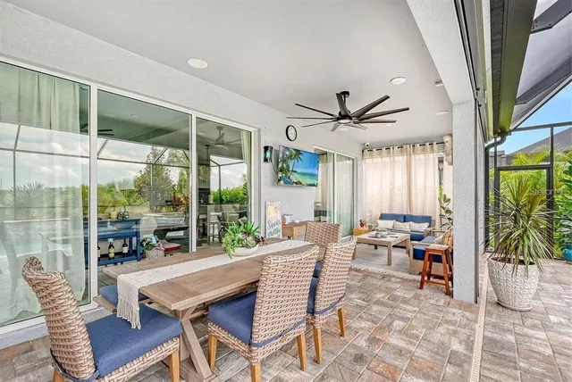 a bedroom with a bed a table and chair