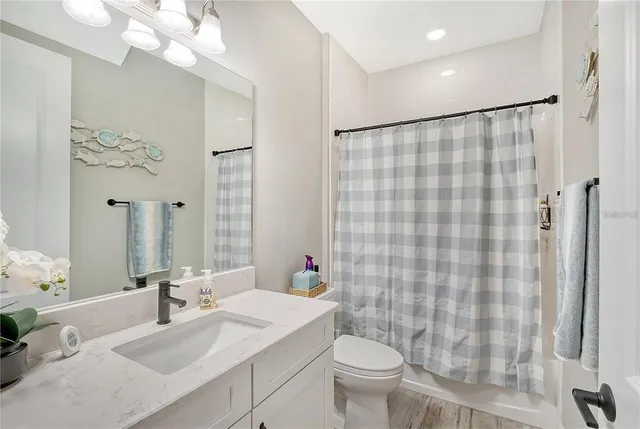 a view of a house with swimming pool and sitting area