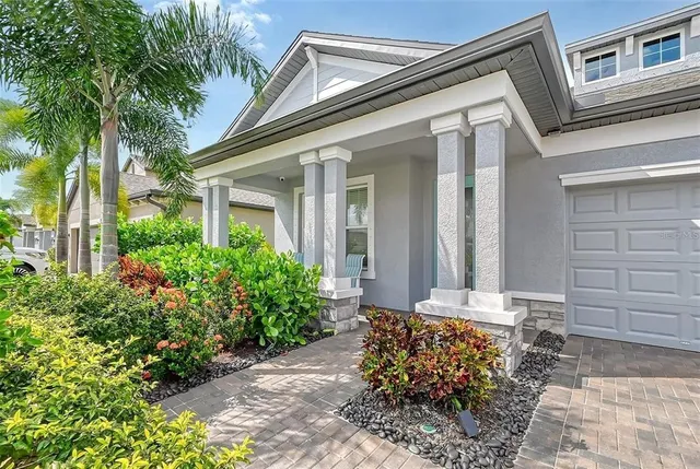 a living room with furniture a rug and a window