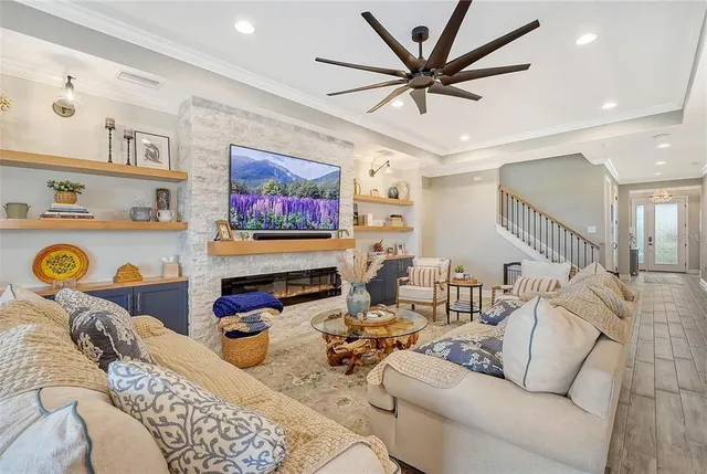 a kitchen with granite countertop a table chairs stove and cabinets