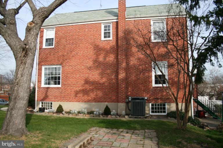543 Larkfield Road Dundalk, MD 21222 - Photo 2 of 30 a view of a brick building next to a yard