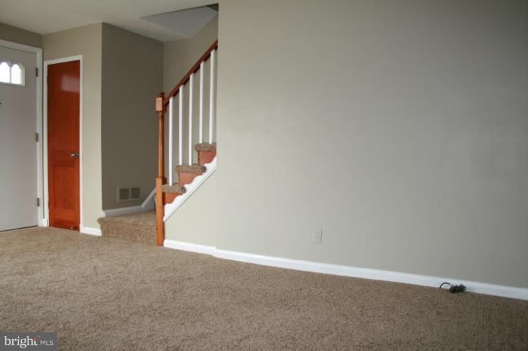 543 Larkfield Road Dundalk, MD 21222 - Photo 15 of 30 a view of an empty room with stairs