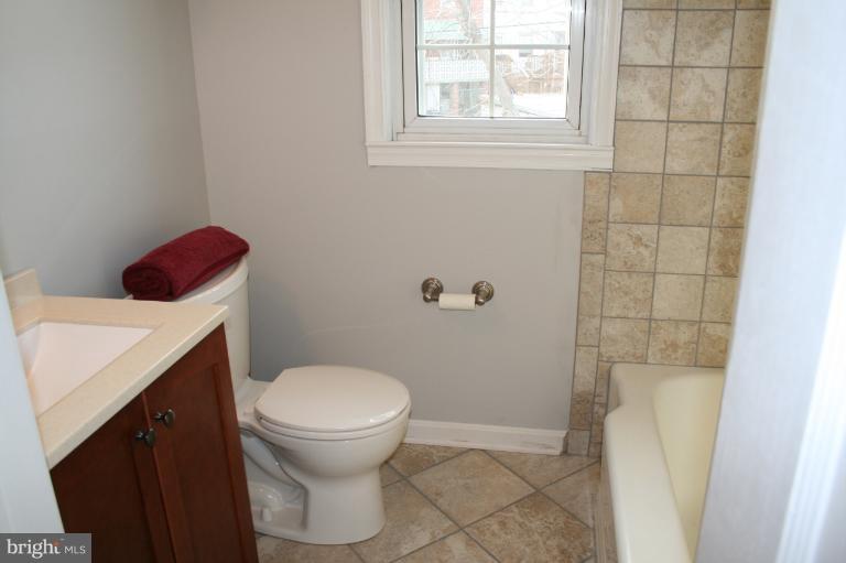 543 Larkfield Road Dundalk, MD 21222 - Photo 16 of 30 a bathroom with a toilet and a shower