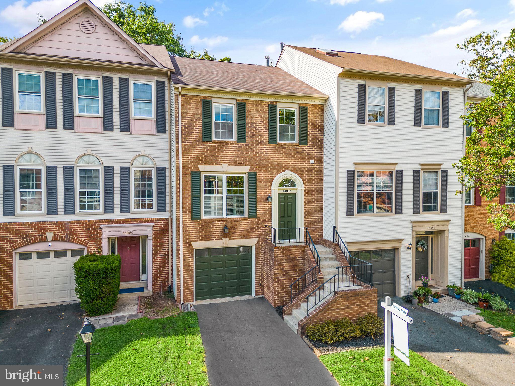 44087 Gala Circle Ashburn, VA 20147 - Photo 1 of 58 a front view of a house with a yard