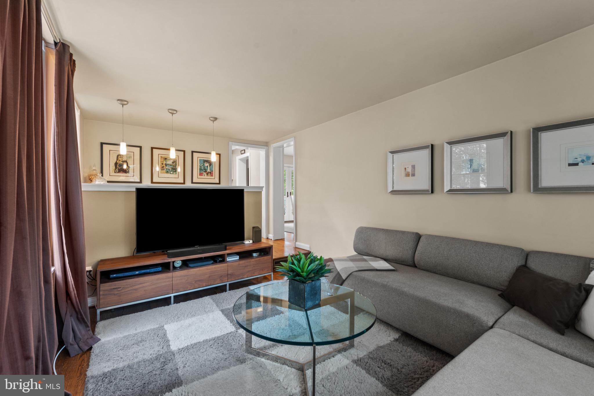 2443 Pickwick Road Baltimore, MD 21207 - Photo 26 of 108 a living room with furniture and a flat screen tv