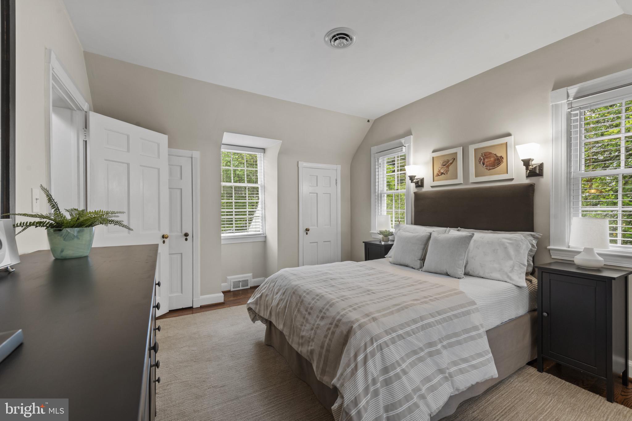 2443 Pickwick Road Baltimore, MD 21207 - Photo 33 of 108 a bedroom with a large bed dresser and a window