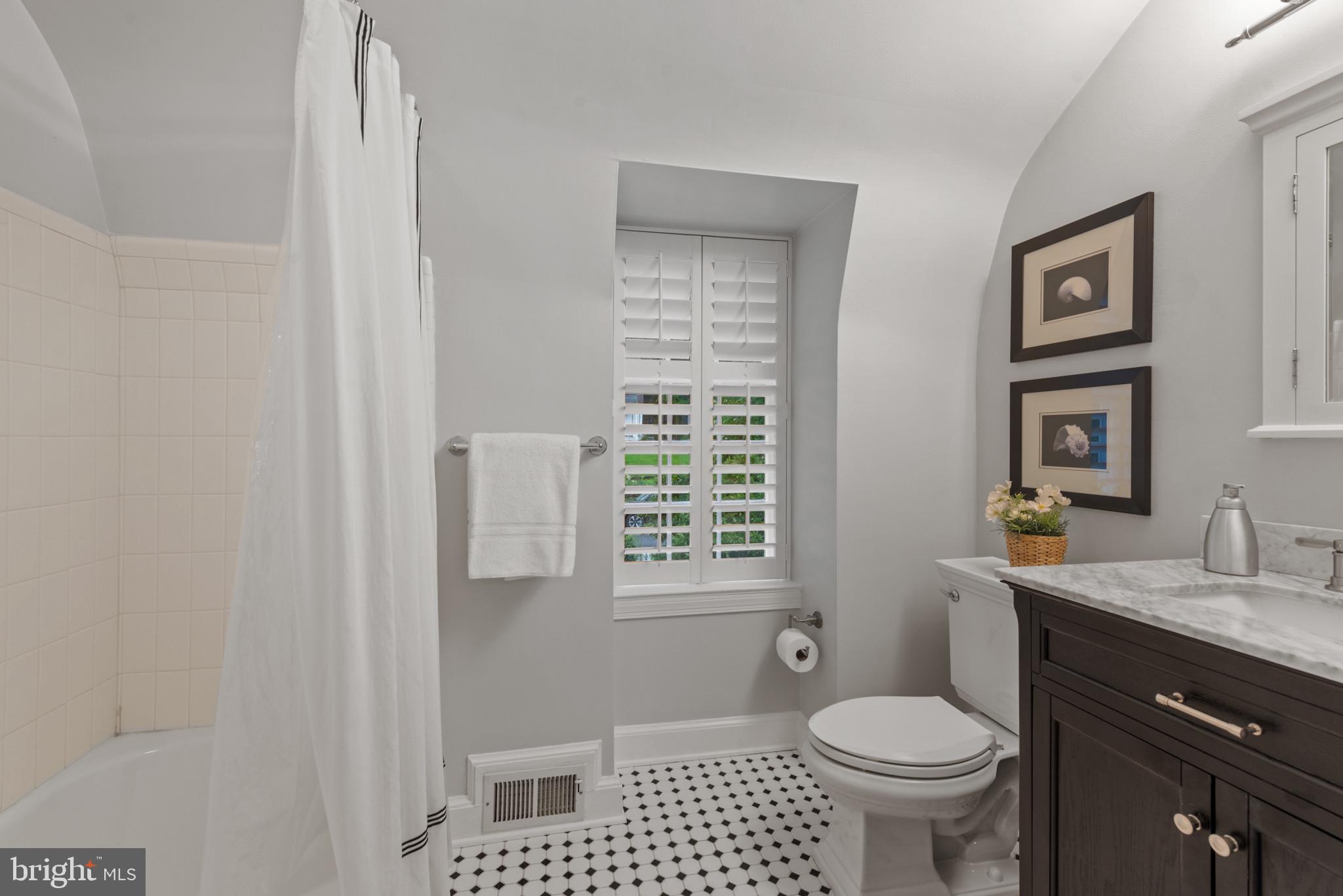 2443 Pickwick Road Baltimore, MD 21207 - Photo 39 of 108 a bathroom with a sink a toilet and shower