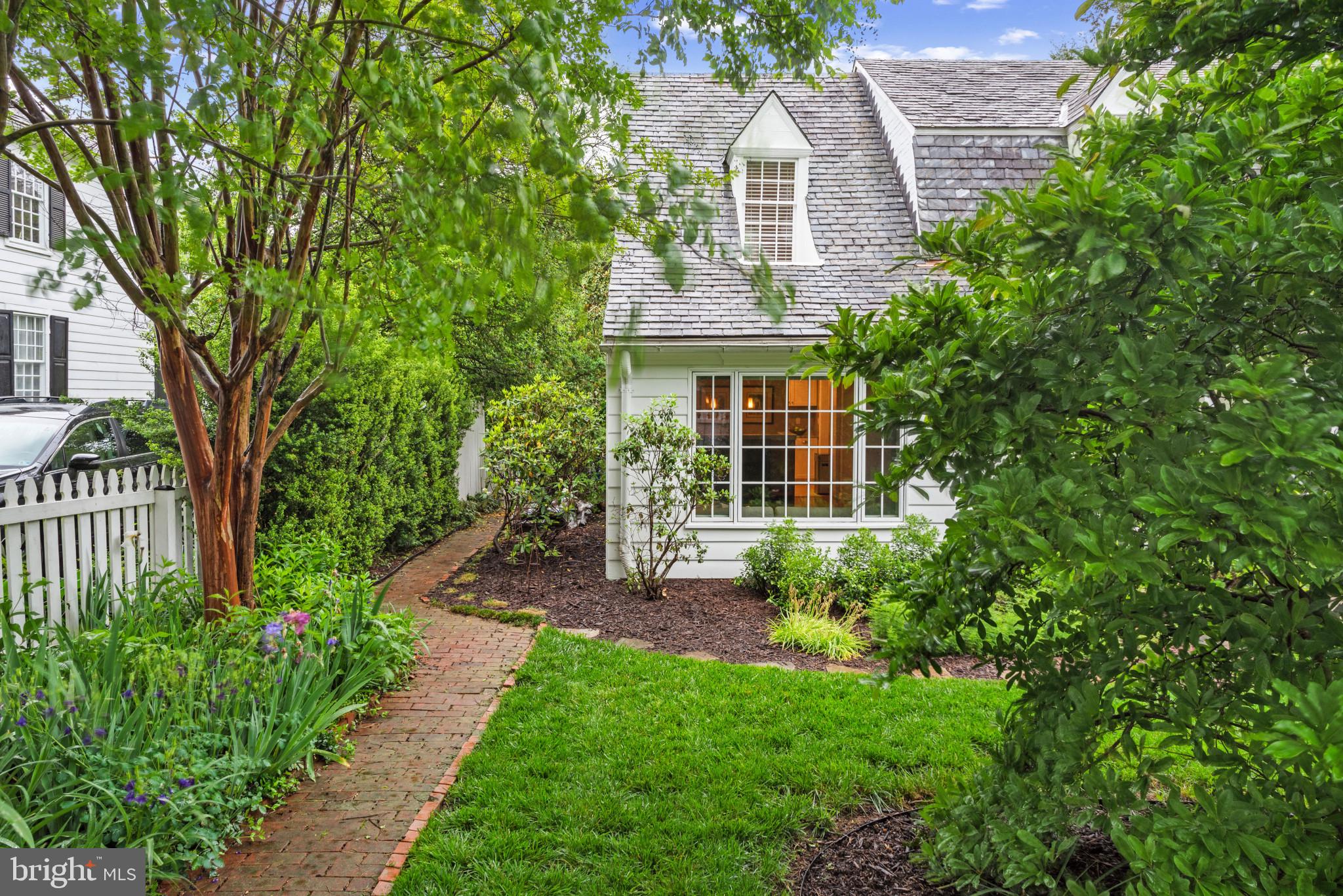 2443 Pickwick Road Baltimore, MD 21207 - Photo 5 of 108 a view of a house with a yard and potted plants
