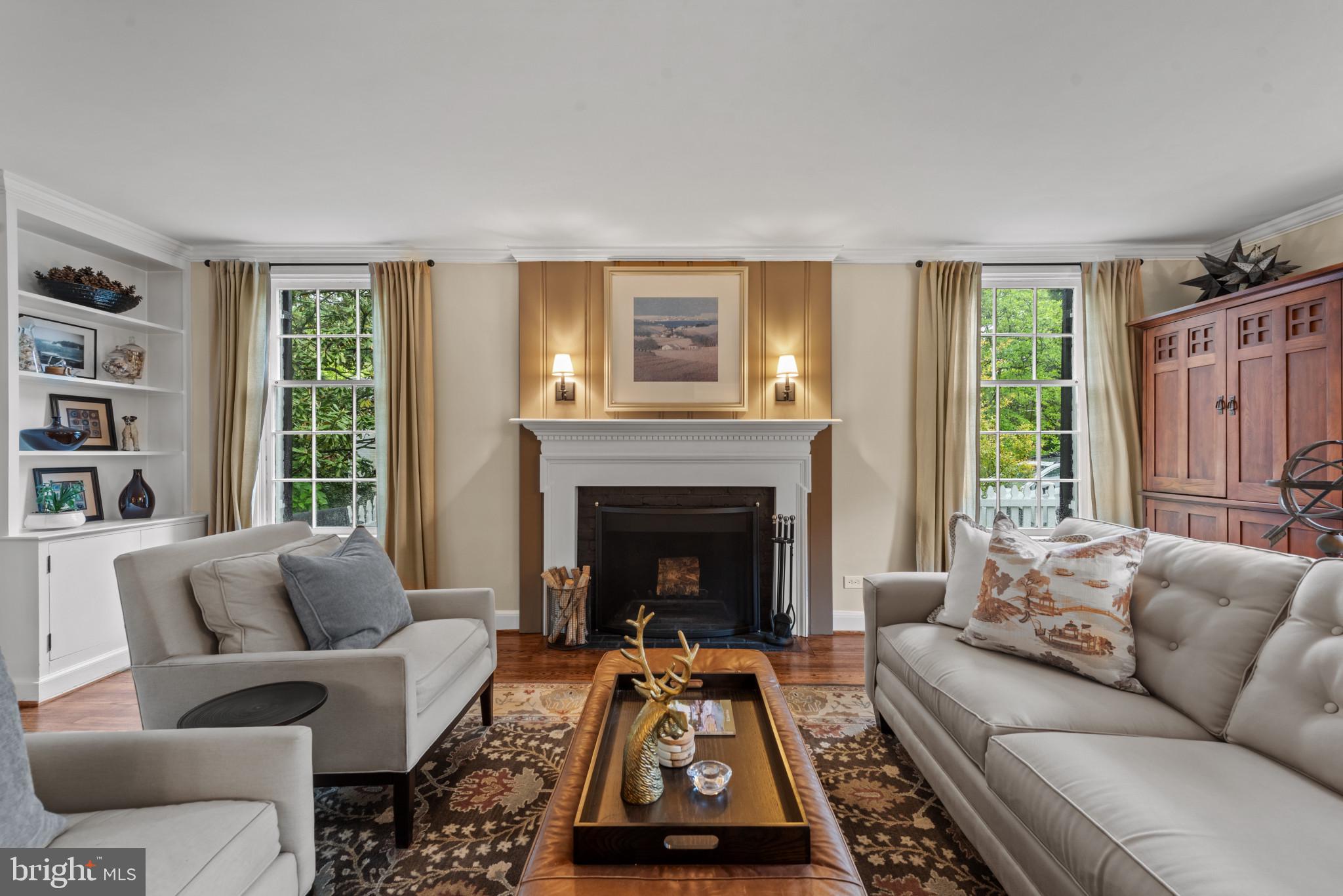 2443 Pickwick Road Baltimore, MD 21207 - Photo 7 of 108 a living room with furniture and a fireplace
