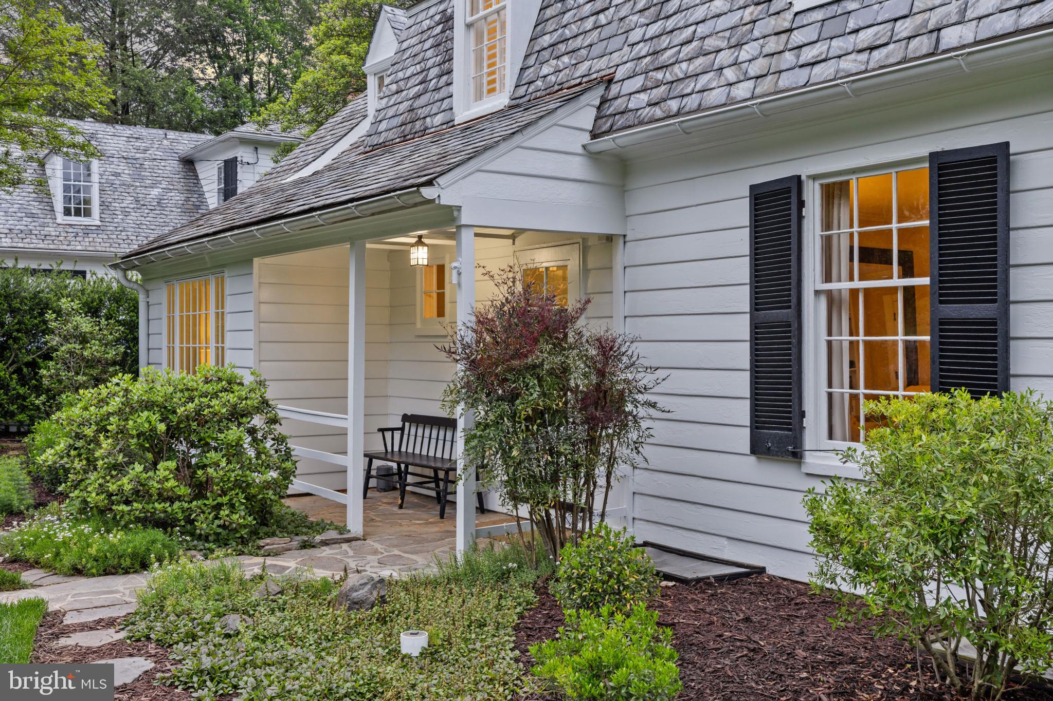 2443 Pickwick Road Baltimore, MD 21207 - Photo 88 of 108 a view of a house with potted plants and a table and chairs