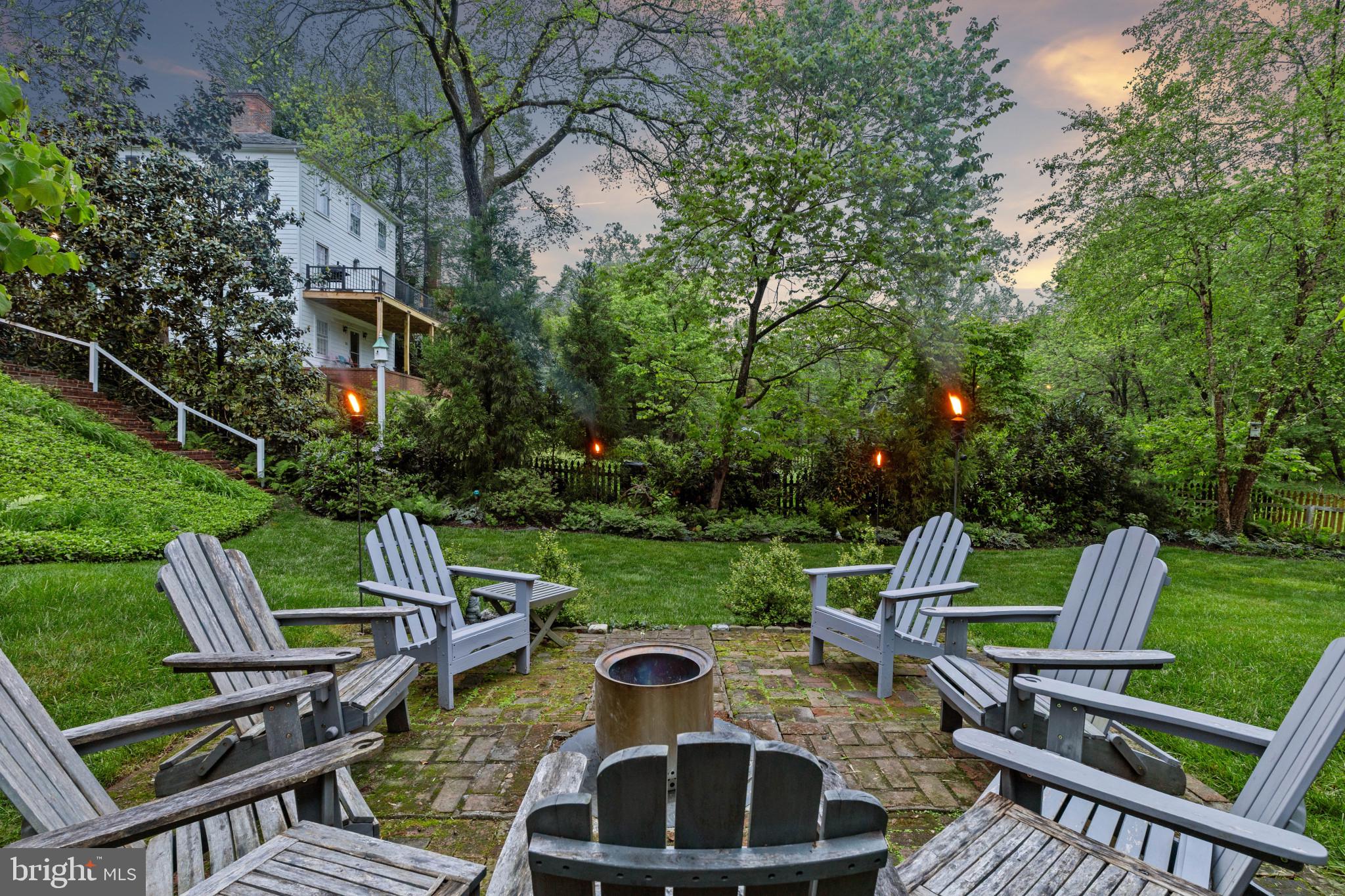 2443 Pickwick Road Baltimore, MD 21207 - Photo 95 of 108 a view of a chairs and table in backyard of the house