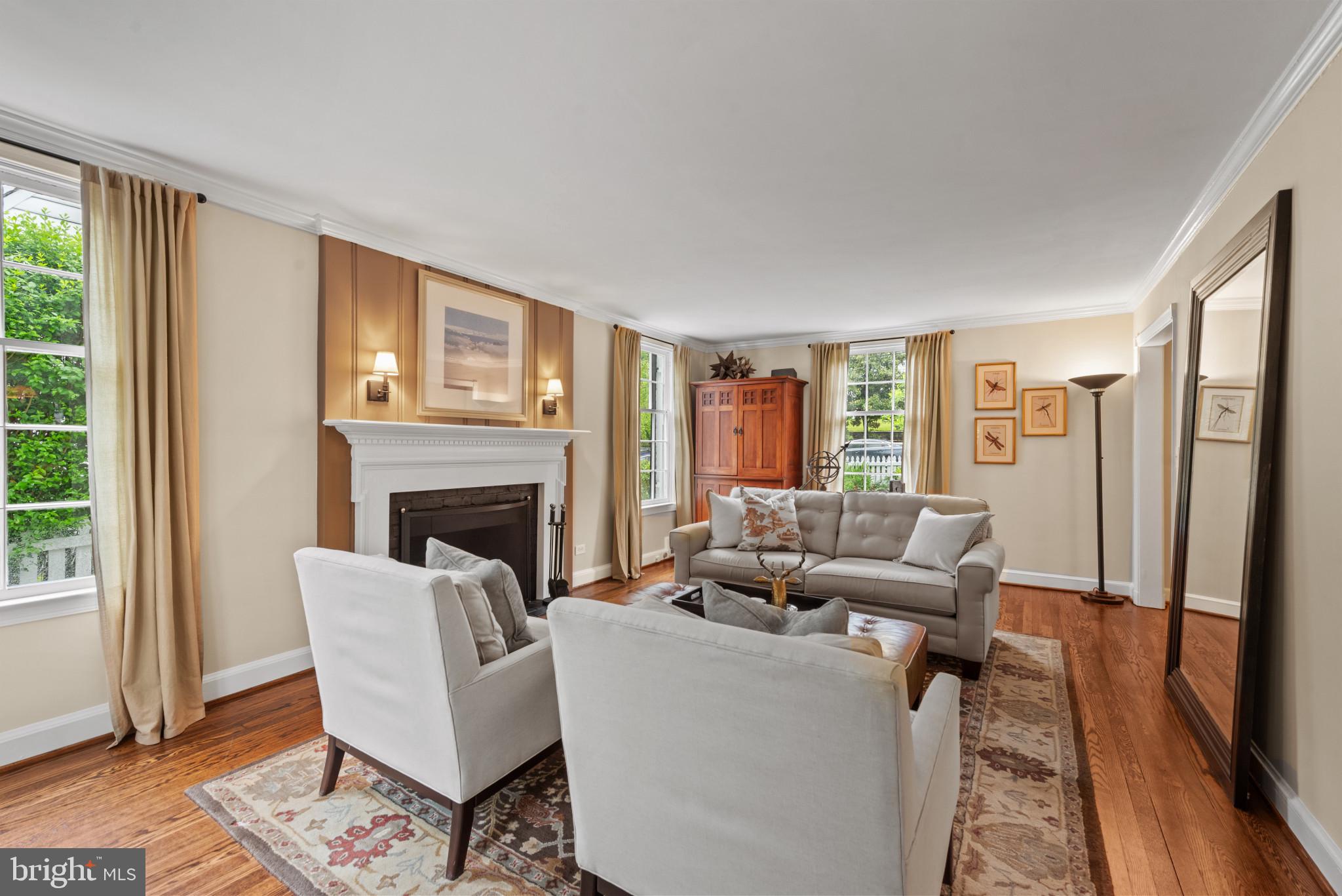 2443 Pickwick Road Baltimore, MD 21207 - Photo 10 of 108 a living room with furniture and a fireplace