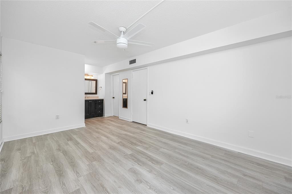 2207 Belleair Road, Unit B4 Clearwater, FL 33764 - Photo 14 of 37 wooden floor in an empty room
