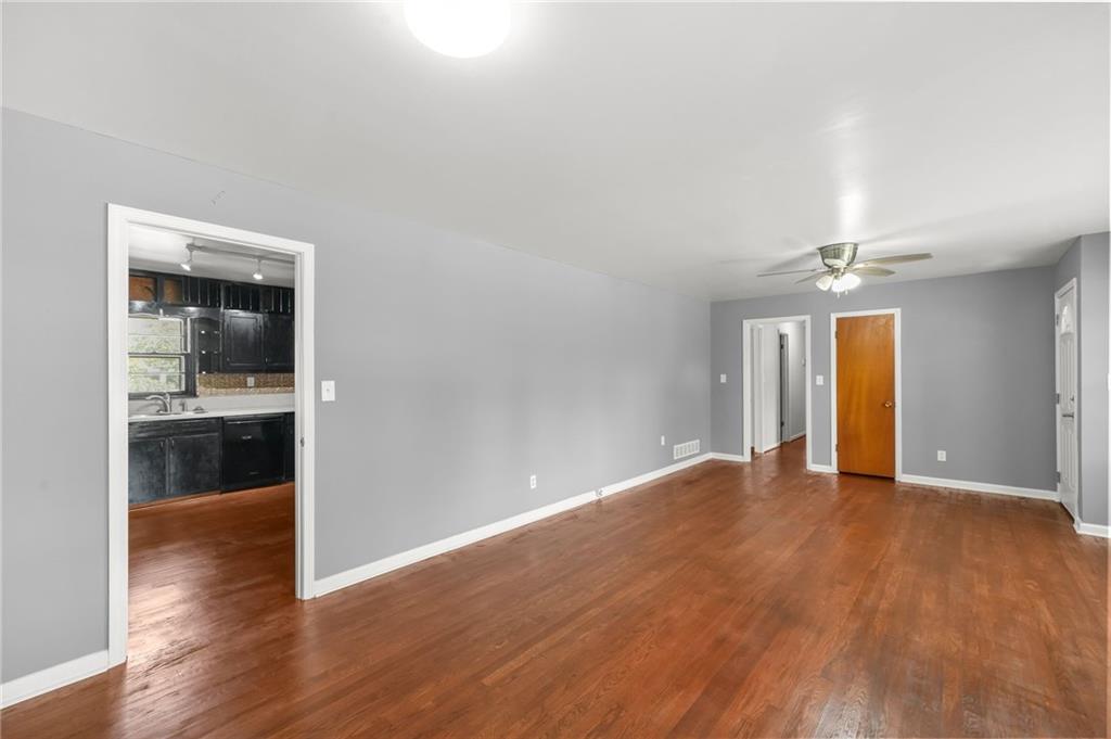 1393 Idlewood Road Tucker, GA 30084 - Photo 11 of 32 wooden floor in an empty room with a window