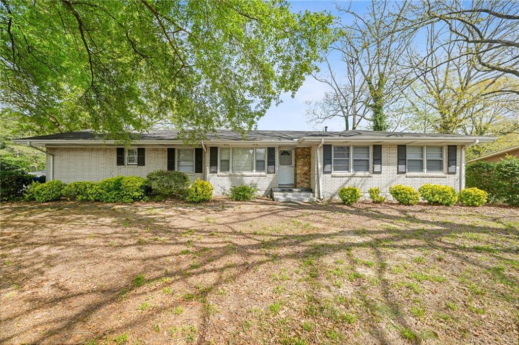 1393 Idlewood Road Tucker, GA 30084 - Photo 2 of 32 a front view of a house with a patio
