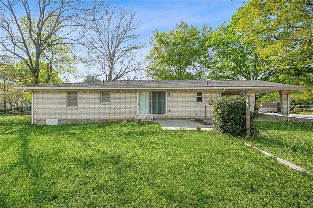 1393 Idlewood Road Tucker, GA 30084 - Photo 25 of 32 a view of a house with a yard