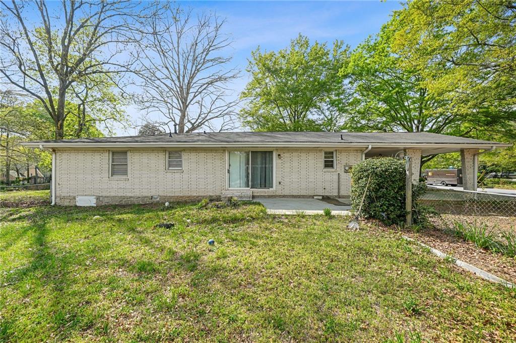 1393 Idlewood Road Tucker, GA 30084 - Photo 26 of 32 a view of a house with a yard
