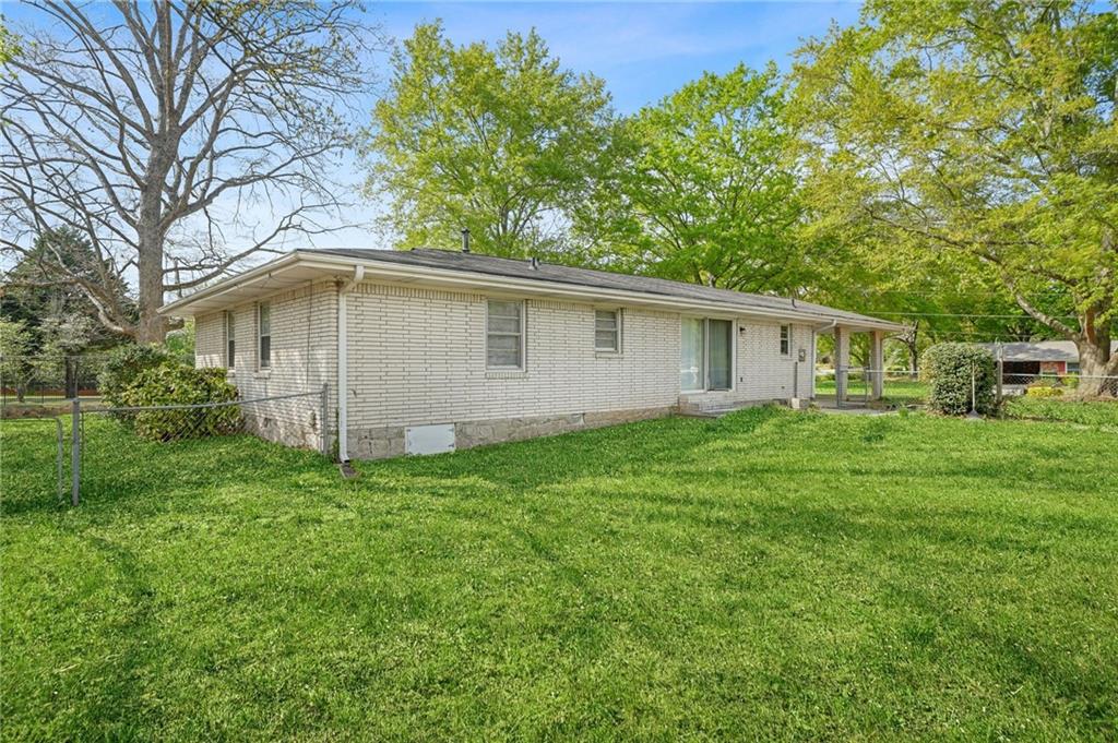 1393 Idlewood Road Tucker, GA 30084 - Photo 27 of 32 a view of a house with a yard