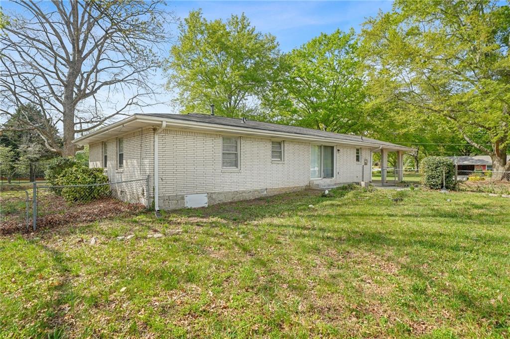 1393 Idlewood Road Tucker, GA 30084 - Photo 28 of 32 a house with a trees in front of it