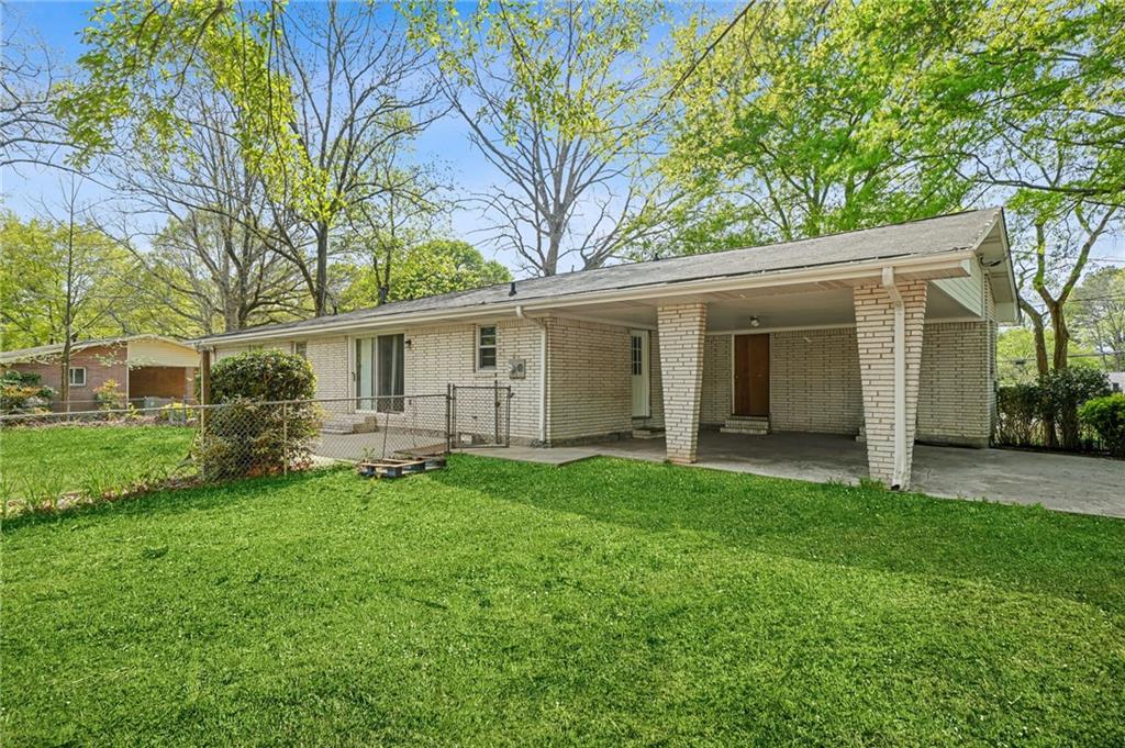 1393 Idlewood Road Tucker, GA 30084 - Photo 29 of 32 a view of a house with a backyard