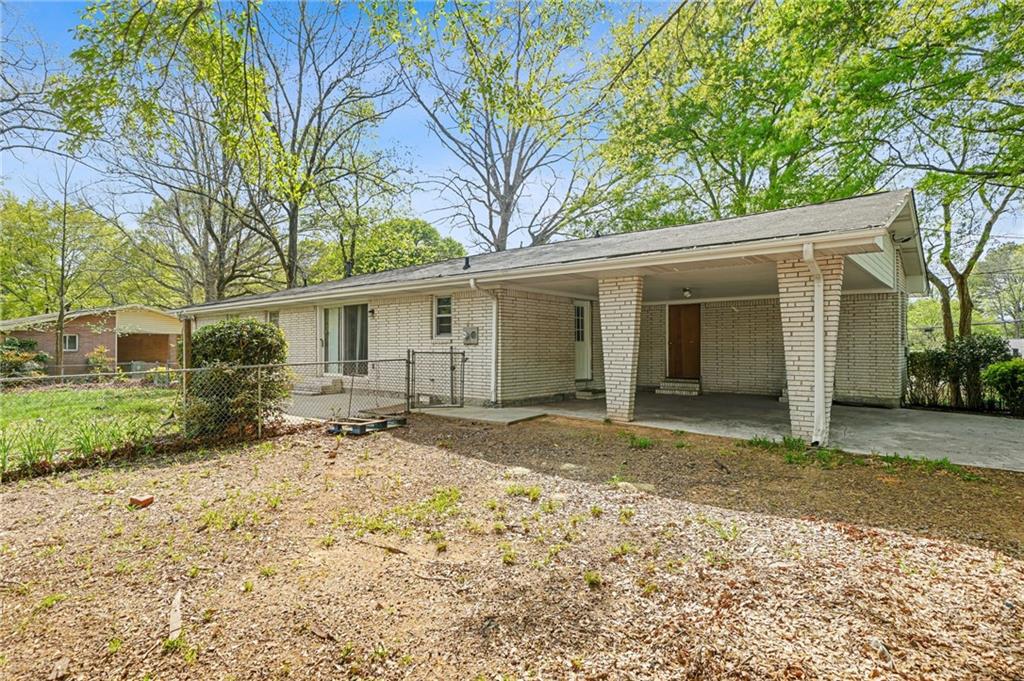 1393 Idlewood Road Tucker, GA 30084 - Photo 30 of 32 a view of a house with a yard
