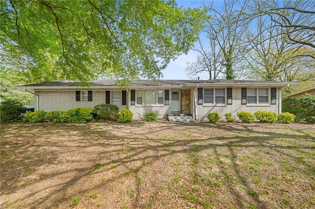 1393 Idlewood Road Tucker, GA 30084 - Photo 6 of 32 front view of a house with a patio