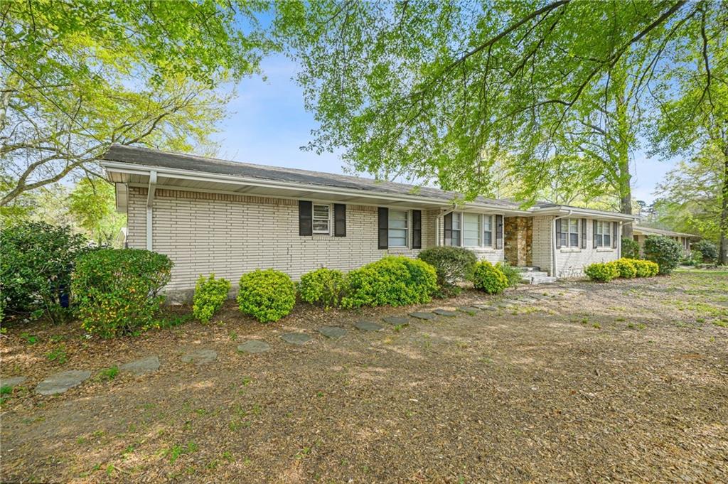 1393 Idlewood Road Tucker, GA 30084 - Photo 8 of 32 front view of a house with a yard