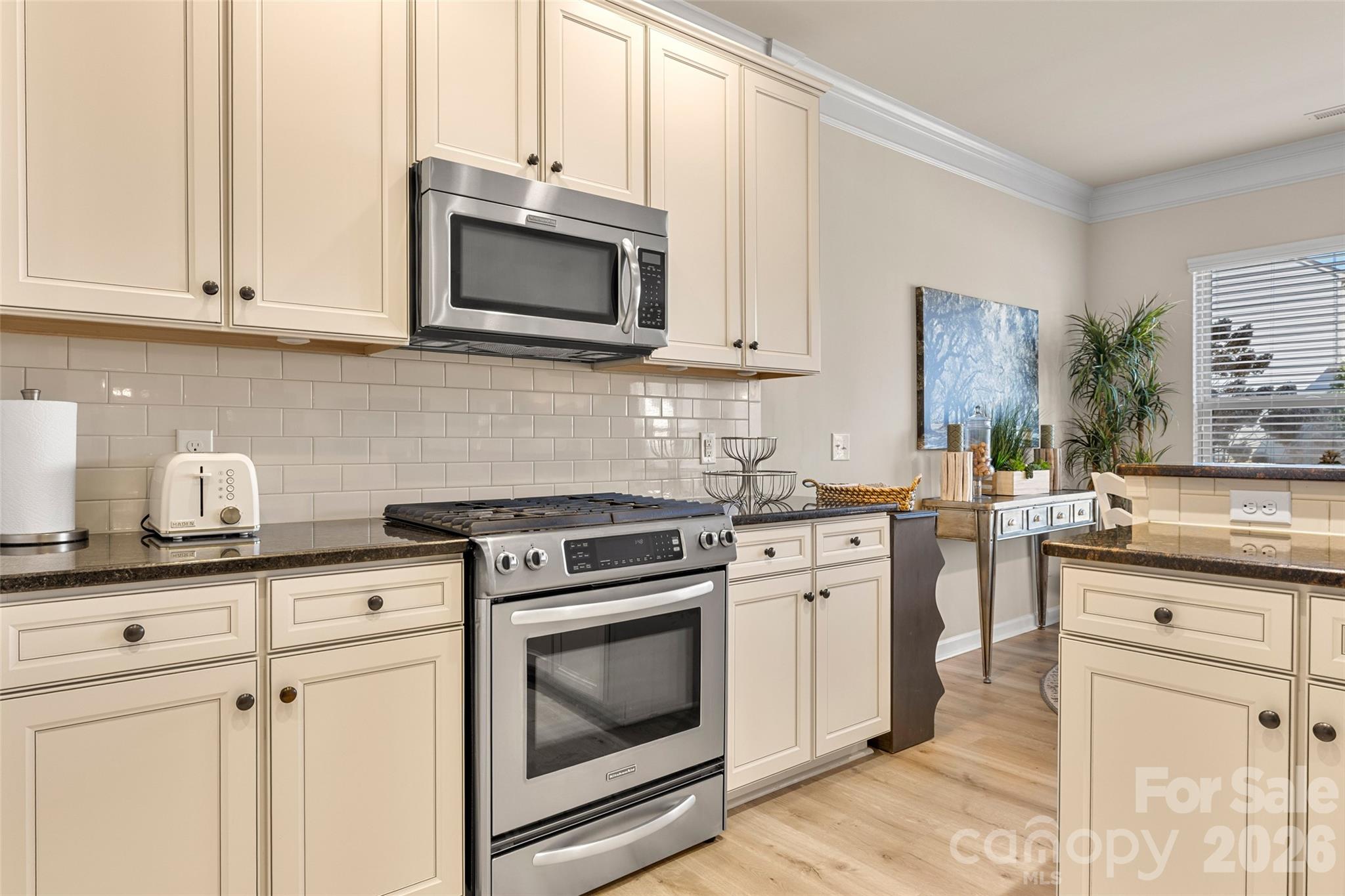 3534 Jumprock Road Fort Mill, SC 29707 - Photo 14 of 36 a kitchen with stainless steel appliances granite countertop white cabinets a sink and dishwasher